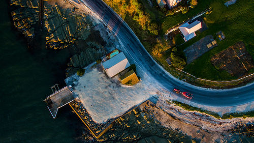 High angle view of cars moving on the lake