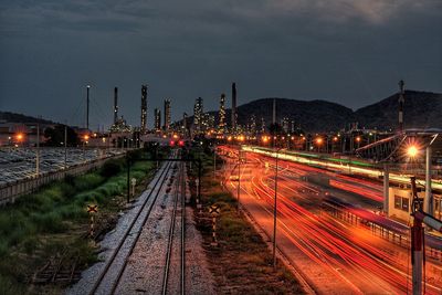 High angle view of light trails on railroad tracks at night