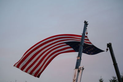 Low angle view of flag against clear sky