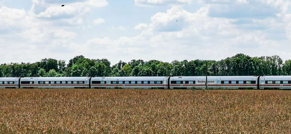 Train on field against sky