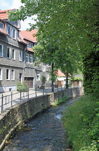 View of canal amidst buildings in town