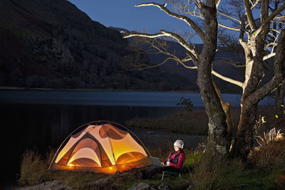 High angle view of tent on mountain by lake