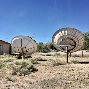 Ferris wheel against clear blue sky
