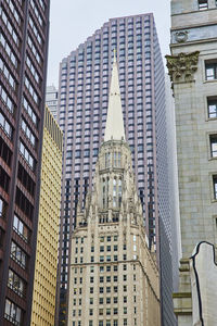 Low angle view of modern buildings against sky