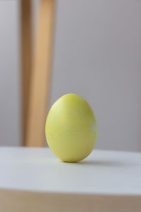 Close-up of yellow ball on table