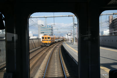 Railroad station platform seen through train window