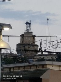 Buildings in city against sky