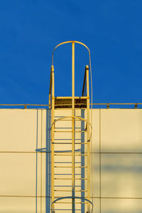 Low angle view of building against clear blue sky