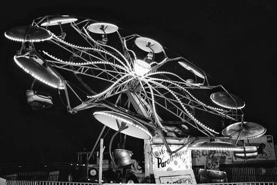 Low angle view of illuminated ferris wheel