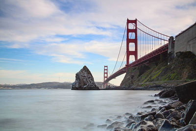 Bridge over sea against sky