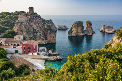 Panoramic shot of sea and buildings against sky