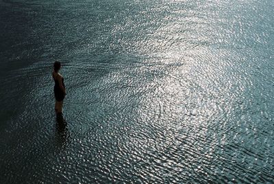 Full length of shirtless boy in sea