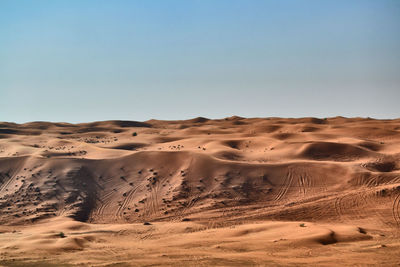 Scenic view of desert against clear sky