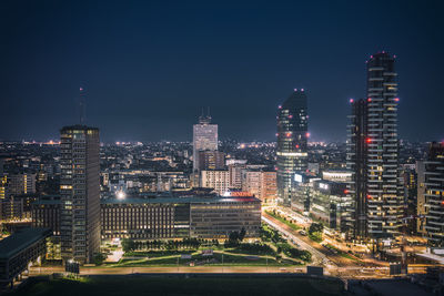 Illuminated buildings in city at night