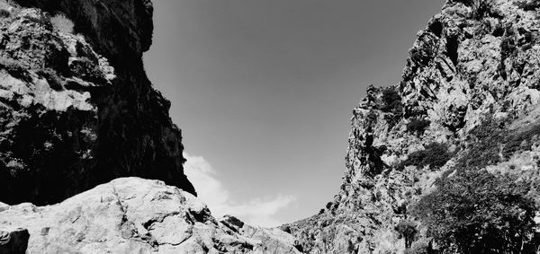 Low angle view of rock formations against sky