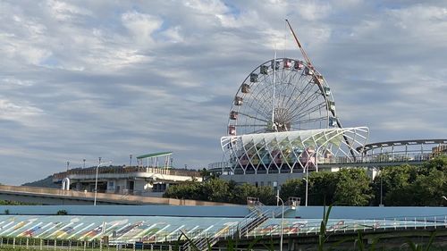 Low angle view of ferris wheel against sky