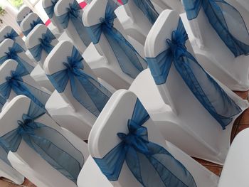 Close-up of decorated chairs in row