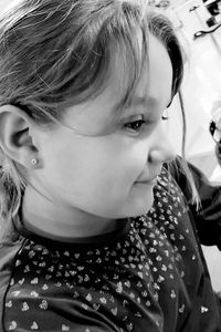 Close-up portrait of cute girl looking away