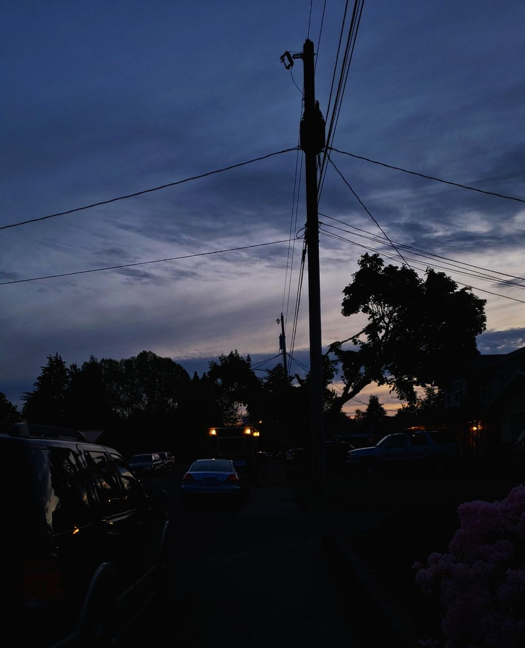 sky, mode of transportation, transportation, motor vehicle, car, cable, electricity, cloud - sky, land vehicle, street, technology, power line, dusk, tree, connection, city, plant, fuel and power generation, silhouette, sunset, power supply, no people, outdoors, telephone line