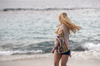 Young woman enjoying at beach