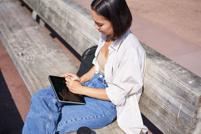 Young woman using phone