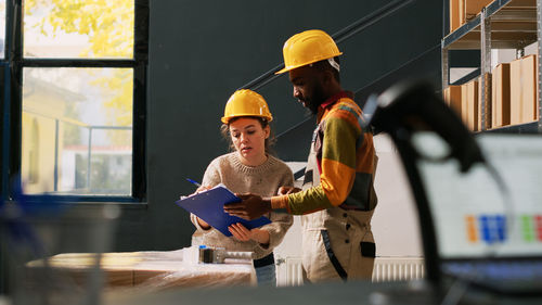 Rear view of man working at home