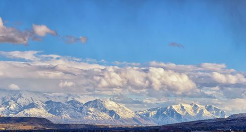 Scenic view of snowcapped mountains against sky