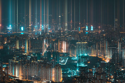 Illuminated modern buildings in city at night