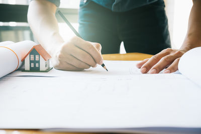 Low section of people working on table