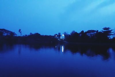 Scenic view of lake against blue sky