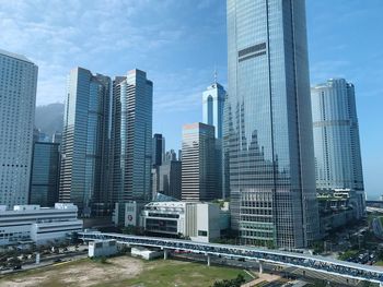 Modern buildings in city against sky