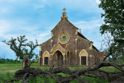 Low angle view of historic building against sky