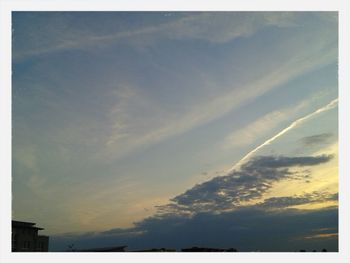 Low angle view of cloudy sky at sunset