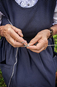 The hands of the elderly woman who knits