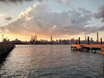 Scenic view of river against sky during sunset