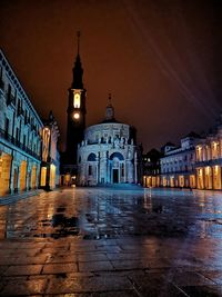 Illuminated buildings in city at night