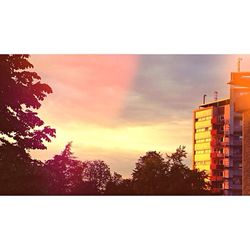 Buildings against sky at sunset