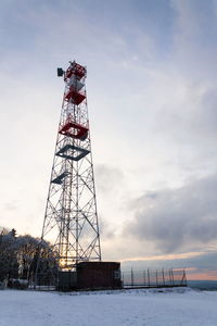 Low angle view of tower against sky during winter