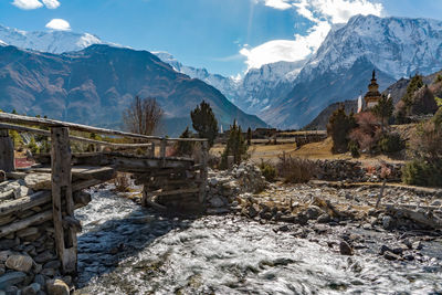 Scenic view of snow covered mountains against sky