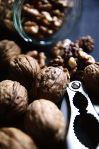 High angle view of walnuts with nutcracker