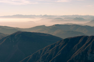 Scenic view of mountains against sky during sunset