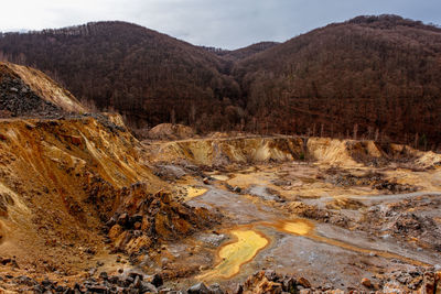 Old abandoned copper and gold surface mine in apuseni mountains, romania