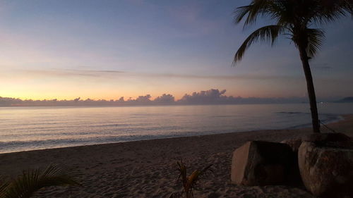 Scenic view of sea against sky at sunset