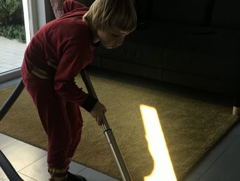 High angle view of boy standing outdoors