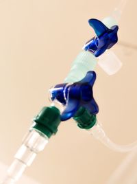 Close-up of electric light over table against white background