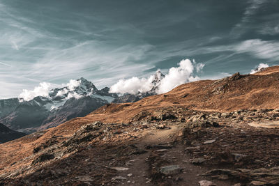 Scenic view of snowcapped mountains against sky