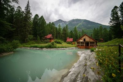 Scenic view of mountains against cloudy sky