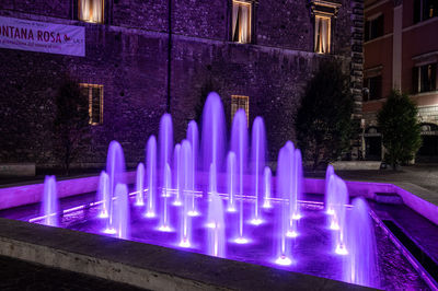 Panoramic view of illuminated building at night