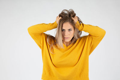 Portrait of a beautiful young woman over white background