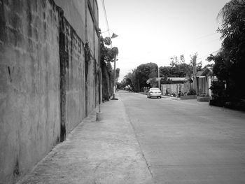 Narrow road along buildings